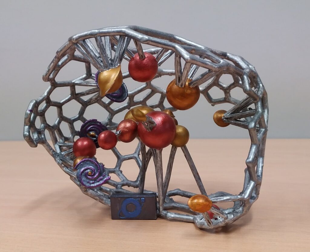 3D model of the Coma galaxy cluster, which includes the 20 brighter galaxies. Modelo 3D del cúmulo de galaxias de Coma, que incluye las 20 galaxias más brillantes